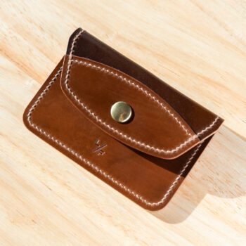 Two-tone shell cordovan snap wallet.