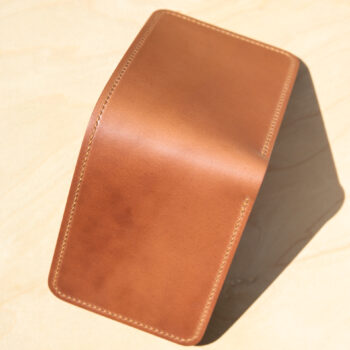 Leather wallet in natural and tobacco brown.