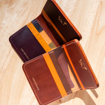 Two leather wallets in a range of autumn colors